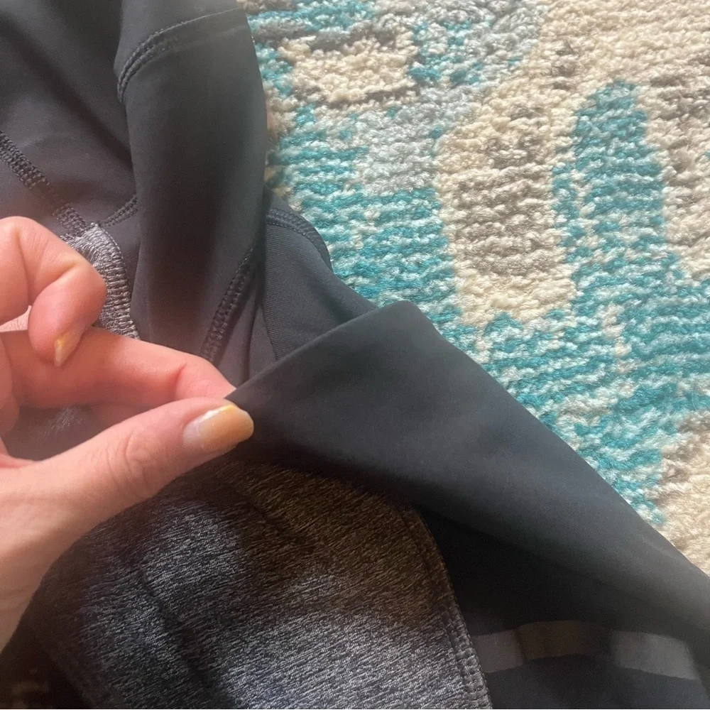 Lululemon black and gray cropped athletic leggings with mesh and pockets